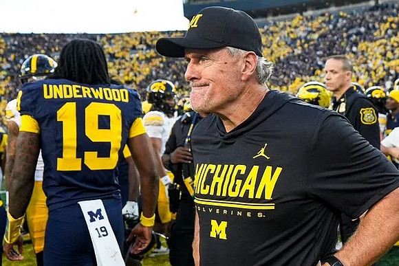 Bryce Underwood (19) and Kyle Whittingham