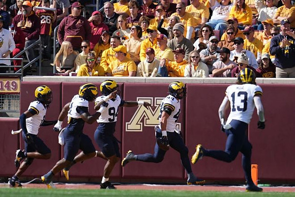 Nathaniel Staehling (44) and Michigan Team