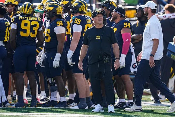 Kyle Whittingham and Michigan Team