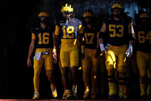 Bryce Underwood (19) and Michigan Team