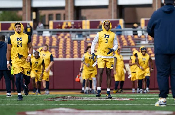 Bryson Kuzdzal (24), Andrew Marsh (3), and Michigan Team