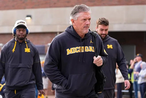 Kyle Whittingham and Michigan Team