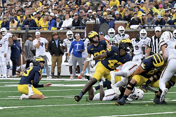 Cam Brown (33), Trey Butkowski (99), Jalen Hoffman (42), and Marky Walbridge (95)