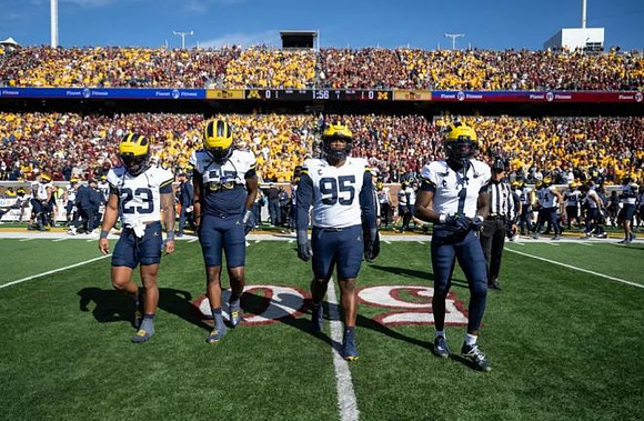 Jordan Marshall (23), Bryce Underwood (19), Trey Pierce (95), and Rod Moore (1)