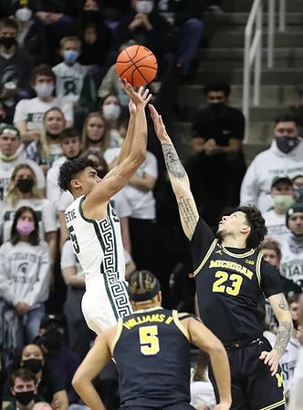 Terrance Williams II (5) and Brandon Johns Jr. (23)