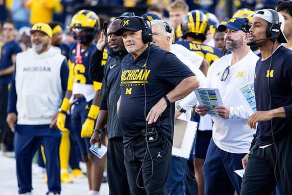 Kyle Whittingham and Michigan Team
