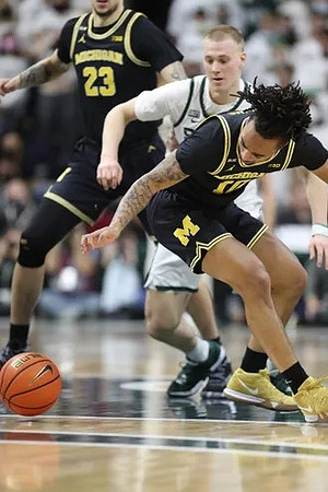 Brandon Johns Jr. (23) and Frankie Collins (10)