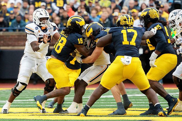 Troy Bowles (18), Max Alford (30), Enow Etta (17), and Trey Pierce (95)