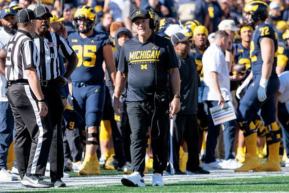 Kyle Whittingham and Michigan Team