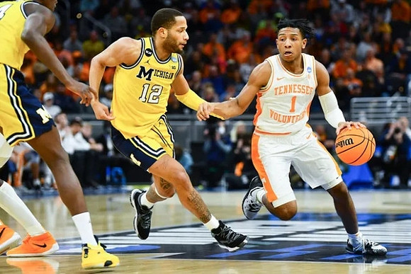 DeVante' Jones (12) and Moussa Diabate (14)