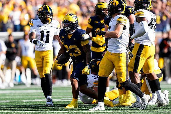 Jordan Marshall (23), Blake Frazier (77), and Travis Johnson (13)