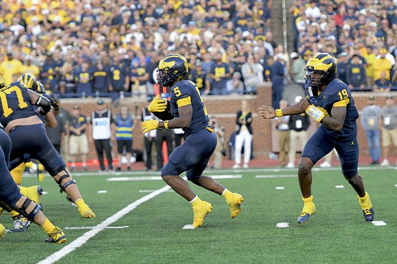 Blake Frazier (77), Savion Hiter (5), and Bryce Underwood (19)