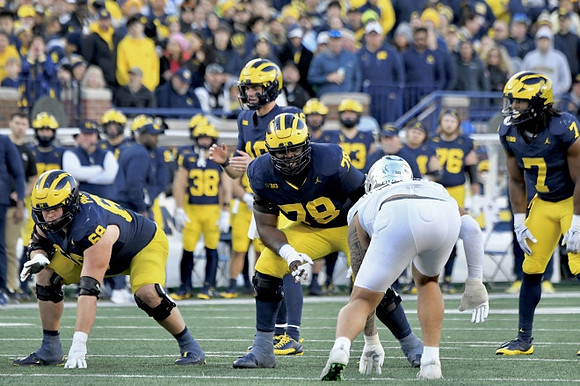 Josh Priebe (68), Davis Warren (16), Myles Hinton (78), and Donovan Edwards (7)