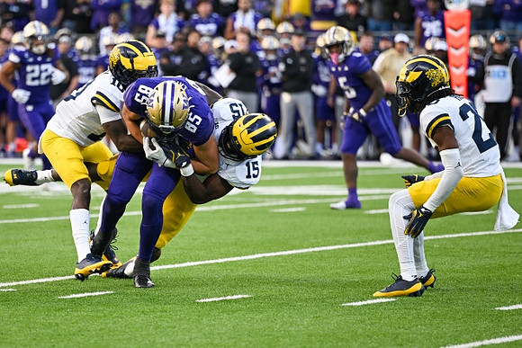 Zeke Berry (10), Ernest Hausmann (15), and Jyaire Hill (20)