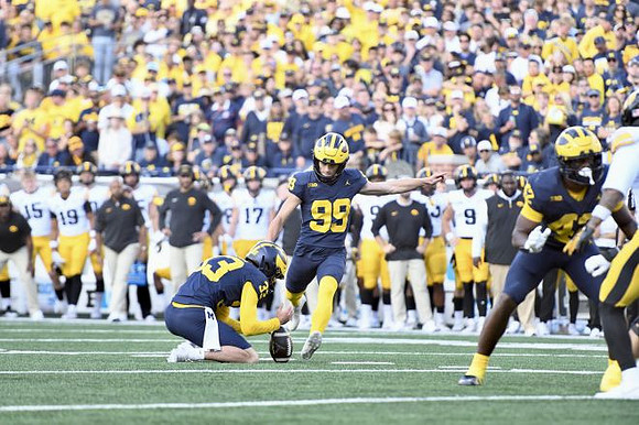 Cam Brown (33), Trey Butkowski (99), and Jalen Hoffman (42)
