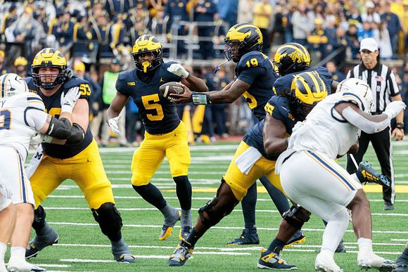 Jake Guarnera (53), Savion Hiter (5), Bryce Underwood (19), and Nathan Efobi (55)