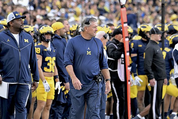 Kyle Whittingham and Michigan Team