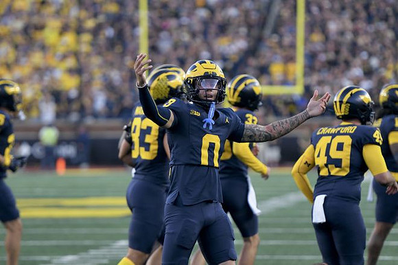Jyaire Hill (0), Benny Patterson III (93), Nico Crawford (49), and Cam Brown (33)