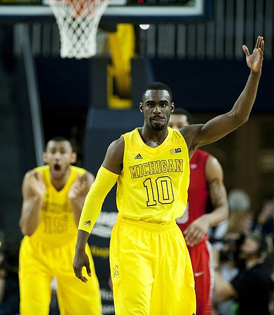 Jon Horford (15) and Tim Hardaway Jr. (10)