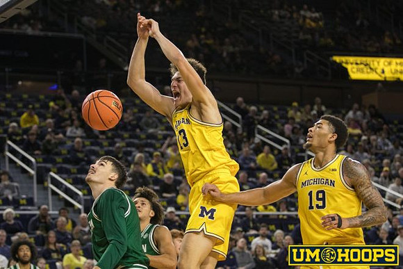 J.P. Estrella (13) and Jalen Reed (19)
