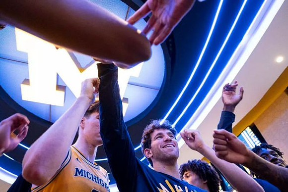 Harrison Hochberg (31) and Michigan Team