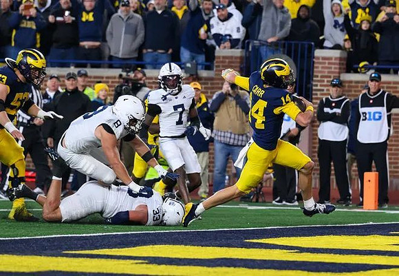Jake Guarnera (53) and Tommy Carr (14)