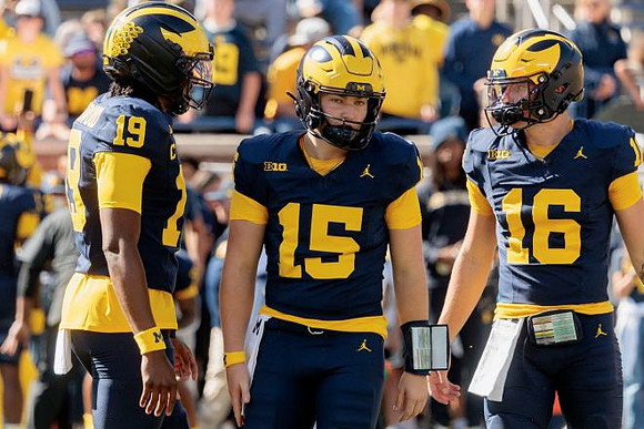 Bryce Underwood (19), Chase Herbstreit (15), and Brayden Fowler-Nicolosi (16)