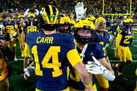 Tommy Carr (14) and Michigan Team