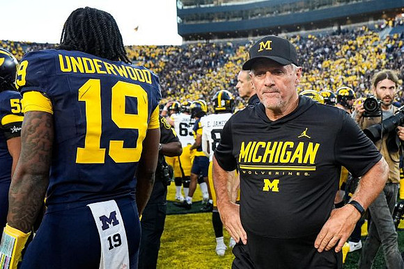 Bryce Underwood (19) and Kyle Whittingham