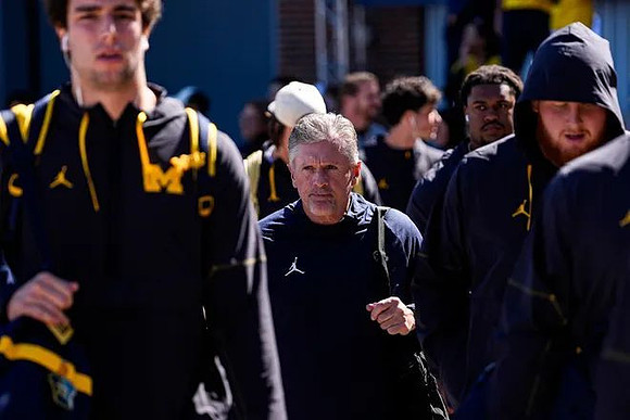 Kyle Whittingham and Michigan Team