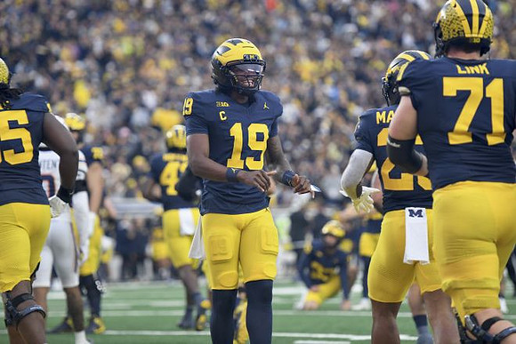 Bryce Underwood (19), Jordan Marshall (23), and Evan Link (71)