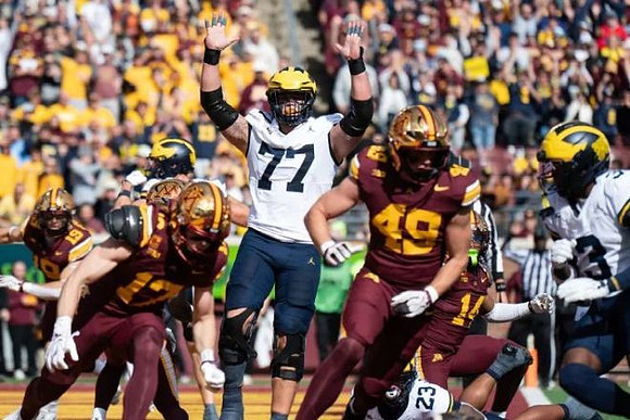 Blake Frazier (77), Jordan Marshall (23), and Andrew Marsh (3)