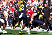 Jalen Hoffman (42), Tommy Carr (14), and Indiana Head Coach Curt Cignetti