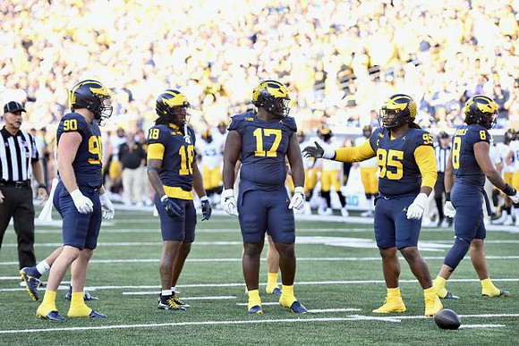 John Henry Daley (90), Troy Bowles (18), Enow Etta (17), Trey Pierce (95), and Dom Nichols (8)