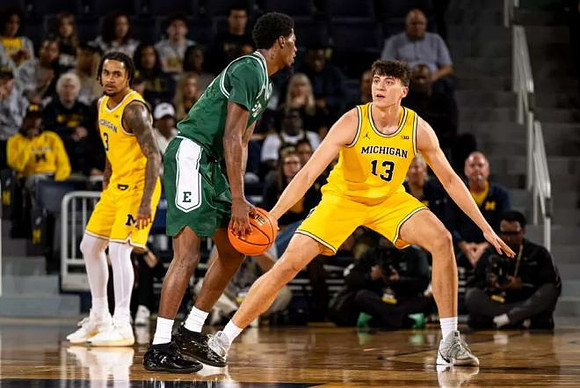 Elliot Cadeau (3) and J.P. Estrella (13)