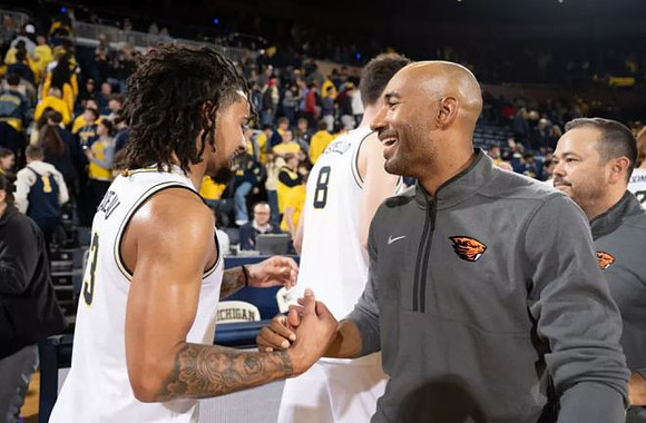 Elliot Cadeau (3), Oregon State Head Coach Justin Joyner, and Quinn Costello (8)
