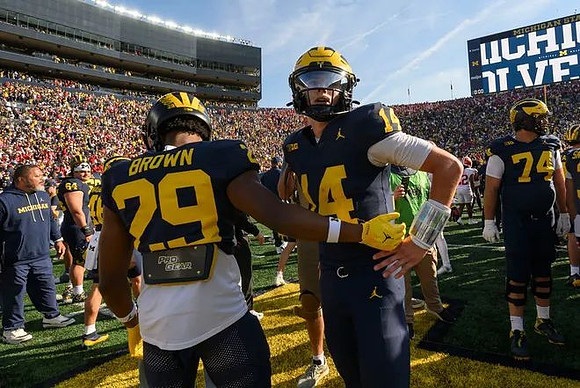 Jonathan Brown (29), Tommy Carr (14), and Avery Gach (74)