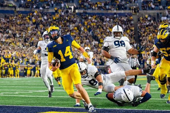 Tommy Carr (14) and Jake Guarnera (53)