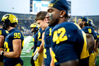 Hudson Hollenbeck (90) and Jalen Hoffman (42)
