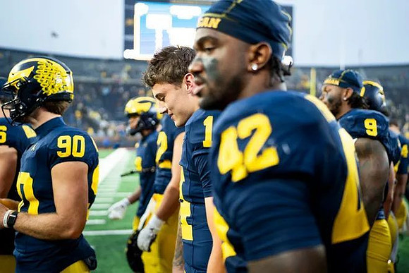 Hudson Hollenbeck (90) and Jalen Hoffman (42)