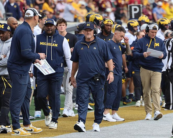 Kyle Whittingham and Michigan Team