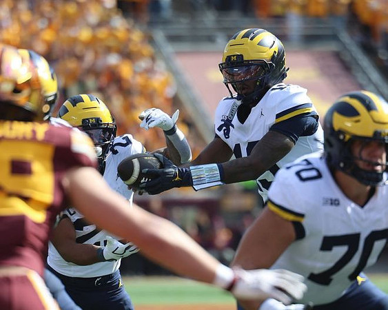 Jordan Marshall (23), Bryce Underwood (19), and Brady Norton (70)