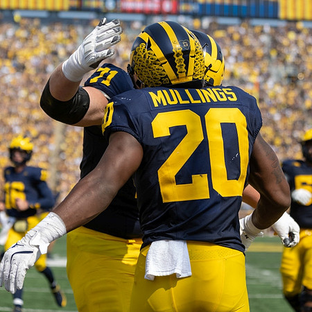 Evan Link (71) and Kalel Mullings (20)