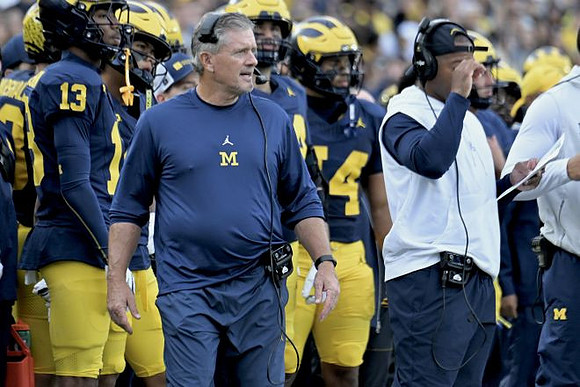 Kyle Whittingham and Michigan Team
