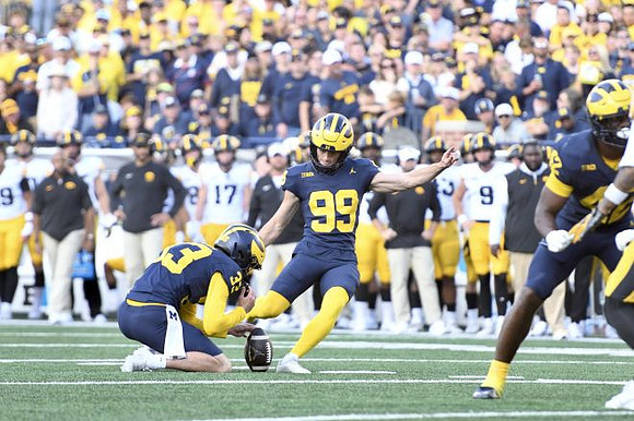 Cam Brown (33), Trey Butkowski (99), and Jalen Hoffman (42)