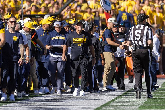 Kyle Whittingham and Michigan Team