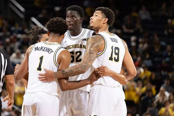 Trey McKenney (1), Moustapha Thiam (52), and Jalen Reed (19)
