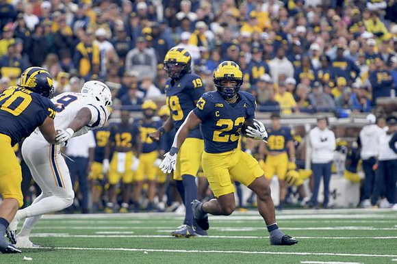 Brady Norton (70), Bryce Underwood (19), and Jordan Marshall (23)