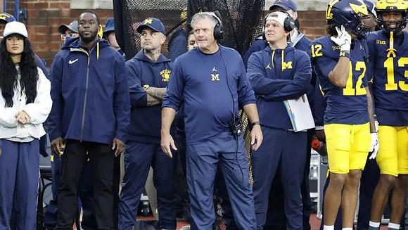 Kyle Whittingham and Michigan Team