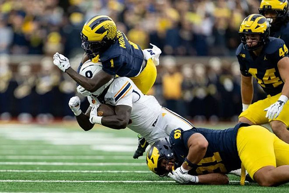 Rod Moore (1), Jonah Lea'ea (91), and Nathaniel Staehling (44)